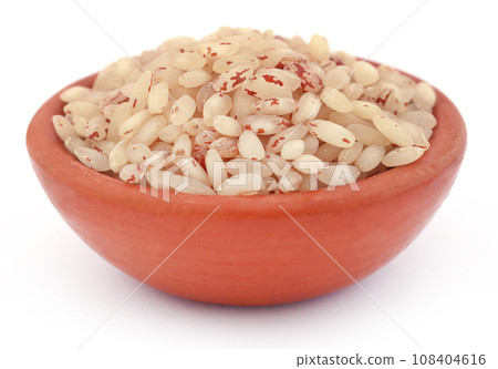 Uncooked rice in a bowl Uncooked rice in a bowl 108404616