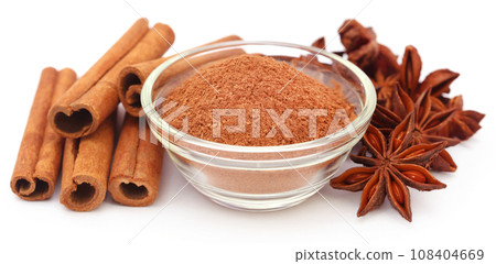 Some aromatic cinnamon with star anise and ground spice Some aromatic cinnamon with star anise and ground spice 108404669