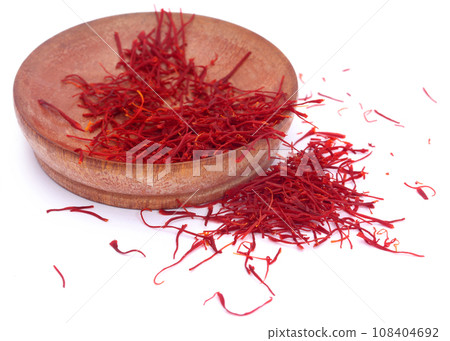Saffron in a wooden bowl Saffron in a wooden bowl 108404692