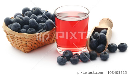 Group of fresh blueberries with juice 108405513