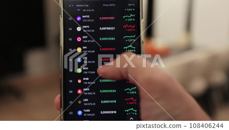 Man checking bitcoin, ethereum and other altcoin cryptocurrency price index on mobile phone screen. Cryptocurrency market. Crypto currency, virtual electronic, internet money. Man checking bitcoin, ethereum and other altcoin cryptocurrency price index on mobile phone screen. Cryptocurrency market. Crypto currency, virtual electronic, internet money. 108406244