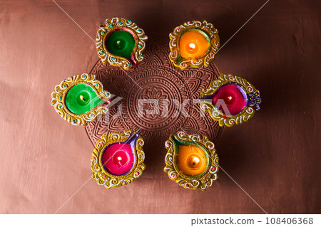 Burning diya on Happy Diwali, background for light festival of India Burning diya on Happy Diwali, background for light festival of India 108406368