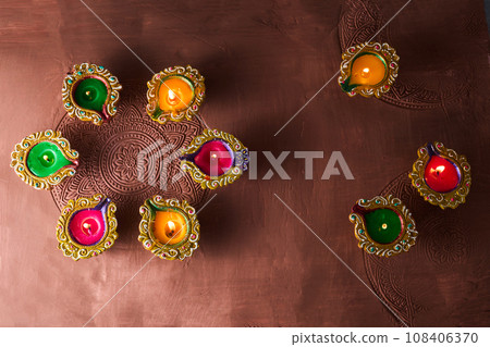 Burning diya on Happy Diwali, background for light festival of India Burning diya on Happy Diwali, background for light festival of India 108406370