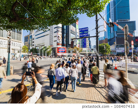 Scramble intersection in front of Shibuya Station on a holiday 108407418