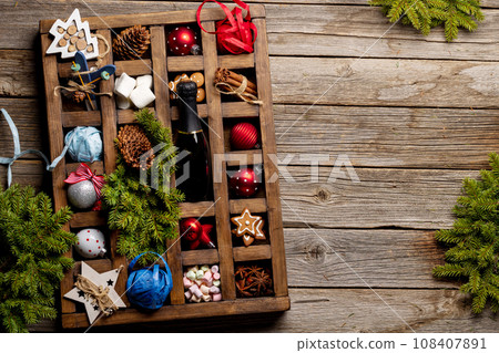 Wooden box with Christmas decor and toys 108407891