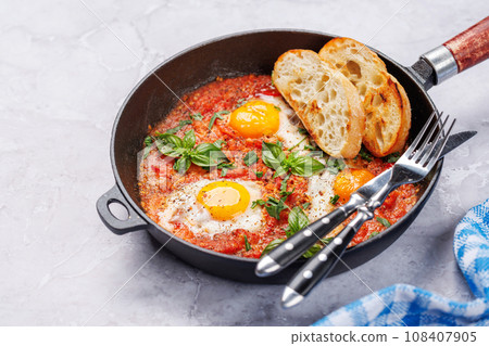 Delicious shakshuka breakfast in a pan Delicious shakshuka breakfast in a pan 108407905