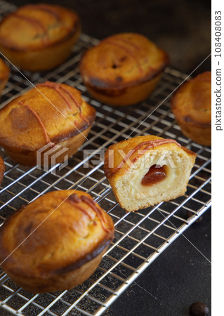 Pasticciotto leccese pastries filled with egg custard cream and sour cherry jam close up Pasticciotto leccese pastries filled with egg custard cream and sour cherry jam close up 108408083