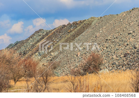 View of slag heaps of iron ore quarry. Mining industry 108408568