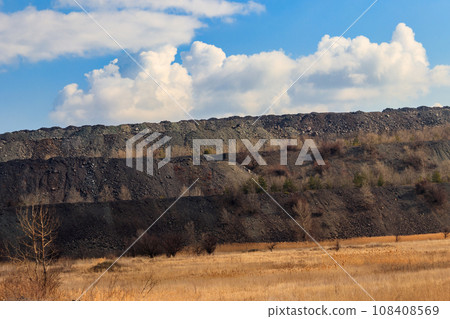 View of slag heaps of iron ore quarry. Mining industry View of slag heaps of iron ore quarry. Mining industry 108408569