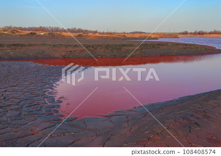 Technical settler of industrial water of mining industry in Kryvyi Rih, Ukraine. Red water polluted with iron ore waste Technical settler of industrial water of mining industry in Kryvyi Rih, Ukraine. Red water polluted with iron ore waste 108408574
