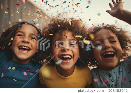 Happy multicultural children having fun celebrating their birthdays with colorful confetti 108408941