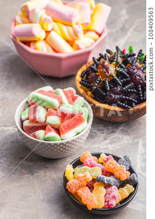 Sweet jelly candies in bowls. Sweet jelly candies in bowls. 108409563
