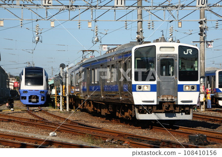 Joban Line: E653 series and 415 series trains parked at Katsuta Rolling Stock Center 108410156