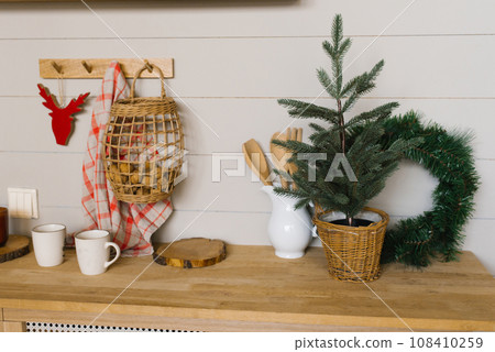 Christmas kitchen, wreath, mugs dishes in Scandinavian style 108410259