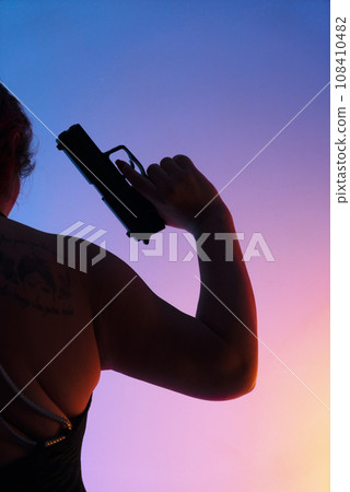 Lady holding pistol gun Lady holding pistol gun 108410482