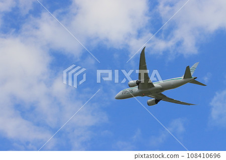 Passenger plane taking off and climbing 108410696