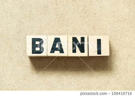 Alphabet letter block in word BANI (Brittle, Anxious, Non-linear and Incomprehensible) on wood background 108410716