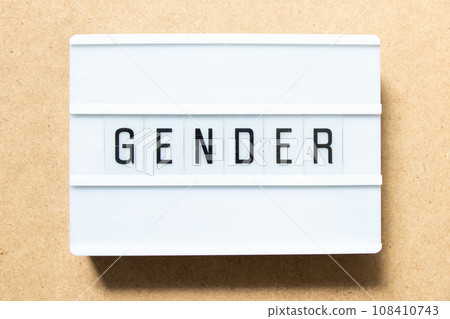 Lightbox with word gender on wood background 108410743