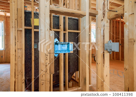 Wiring in new home under construction interior view of a electrical box Wiring in new home under construction interior view of a electrical box 108411398