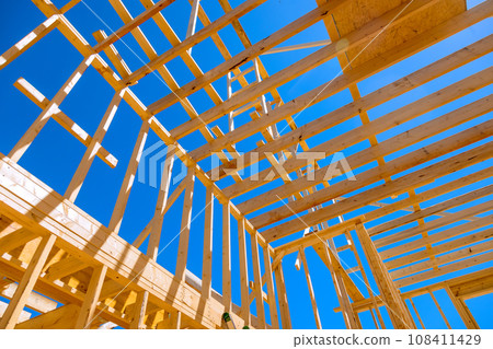 New house roof construction using wooden frame trusses support beams New house roof construction using wooden frame trusses support beams 108411429