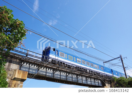 Scene of a Kilo 47 diesel car passing over a short railway bridge Scene of a Kilo 47 diesel car passing over a short railway bridge 108413142