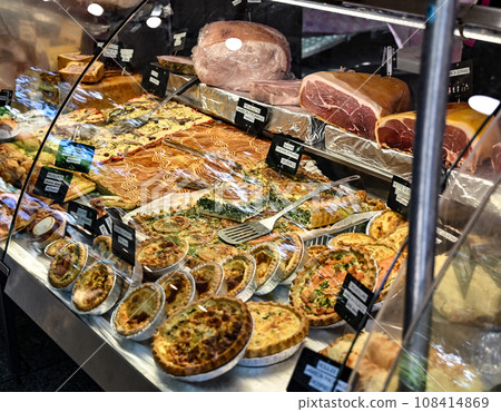 Paris, France. June 30 2022. At the beautiful Popincourt local market, a food stall with French savory pie specialities. 108414869