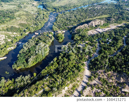 Winding bed of the Southern Bug river. River, landscape from a bird's eye view. Rough, rocky terrain. Winding bed of the Southern Bug river. River, landscape from a bird's eye view. Rough, rocky terrain. 108415271