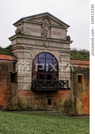 Old Lublin gate (Brama Lubelska) of fortress in Zamosc, Poland. Ancient fortification brick wall. Old Lublin gate (Brama Lubelska) of fortress in Zamosc, Poland. Ancient fortification brick wall. 108415298