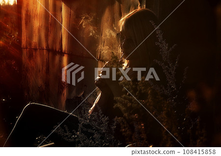 Fashion art portrait of beauty model woman in bright lights with colorful smoke. Smoking girl, Close up of a female inhaling from an electronic cigarette. High quality photo Fashion art portrait of beauty model woman in bright lights with colorful smoke. Smoking girl, Close up of a female inhaling from an electronic cigarette. High quality photo 108415858