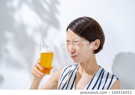 Woman drinking beer Woman drinking beer 108416052