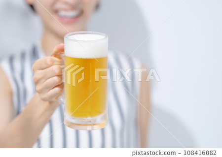 Woman drinking beer Woman drinking beer 108416082