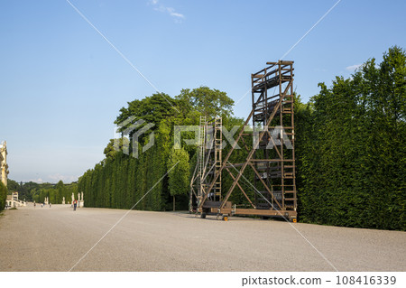 Construction for pruning trees and shrubs in the summer Imperial Palace Schoenbrunn Park 108416339