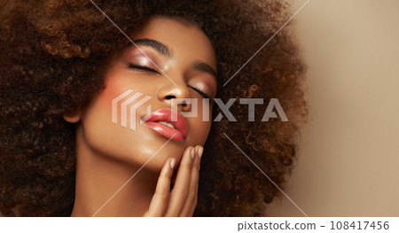 Beauty portrait of African American girl with afro hair 108417456