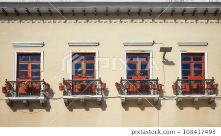 Street view of an old colonial building facade in Quito, Ecuador. 108417493