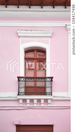 Street view of an old colonial building facade in Quito, Ecuador. 108417496