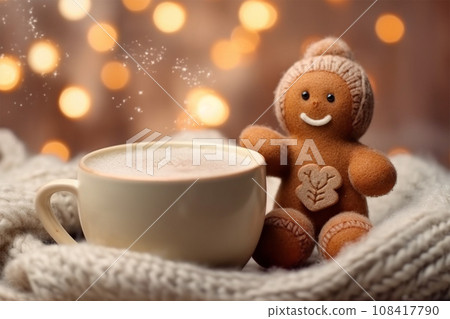 knitted gingerbread man near a cup of cappuccino on a Christmas background 108417790