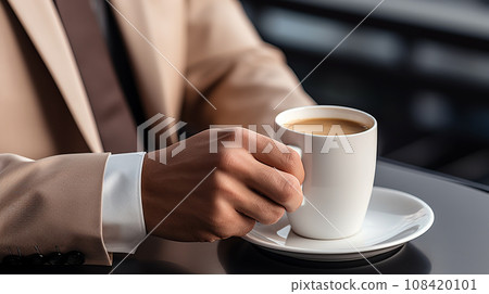 A businessman with a coffee cup A businessman with a coffee cup 108420101