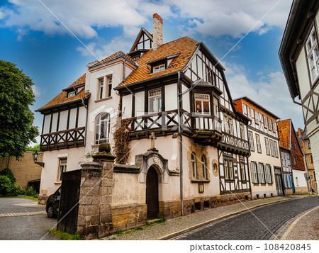 small town with old vintage small colored houses and old cobblestone pavement small town with old vintage small colored houses and old cobblestone pavement 108420845