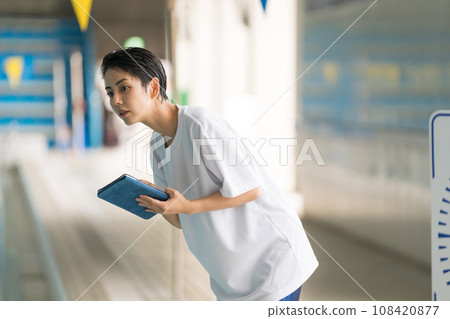 swimming instruction and tablet 108420877