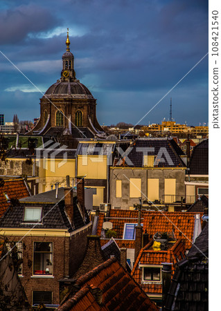 Cityscape of Amsterdam, old type buildings and channels 108421540