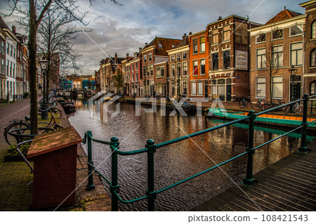 Cityscape of Amsterdam, old type buildings and channels Cityscape of Amsterdam, old type buildings and channels 108421543