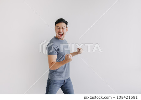 Happy asian man feels victory emotion stand isolated on white, Win and success 108421681