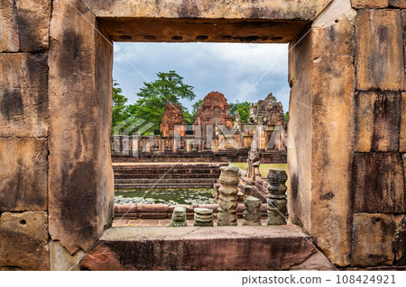 Fantastic ancient ruins of Prasat Muang Tao, view through the window Near Phanom Rung Prasat Historical Park. Buriram Province, Thailand Fantastic ancient ruins of Prasat Muang Tao, view through the window Near Phanom Rung Prasat Historical Park. Buriram Province, Thailand 108424921
