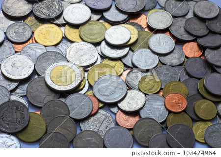 Many baht coins of various denominations are placed in the background. Copy space Many baht coins of various denominations are placed in the background. Copy space 108424964