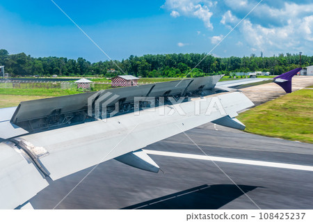 The wings of an airplane during landing provide lift and resistance to stop. The wings of an airplane during landing provide lift and resistance to stop. 108425237