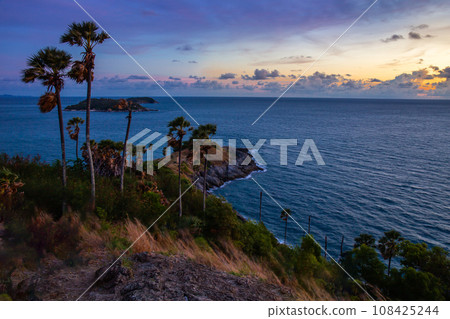 Laem Phromthep Viewpoint at dusk is a popular landmark for traveling to watch the most romantic sunset in Phuket, Thailand. 108425244