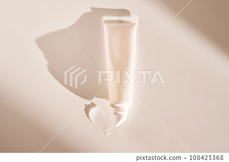 Hygienic moisturizing lip balm in a tube on a white background. 108425368