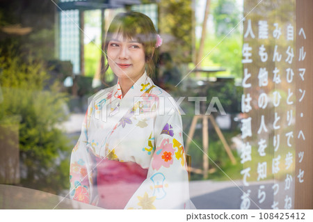 Young woman wearing Japanese traditional kimono in Japanese style wooden house 108425412