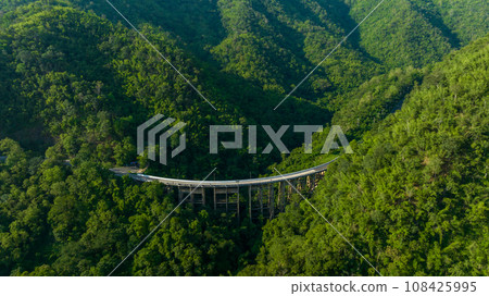 Aerial view of bridge, car, mountain forest, Landscape with beautiful road, Bridge and the road over the mountain. Aerial view of bridge, car, mountain forest, Landscape with beautiful road, Bridge and the road over the mountain. 108425995