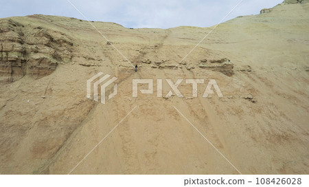 Colorful high mountains and a canyon made of clay Colorful high mountains and a canyon made of clay 108426028
